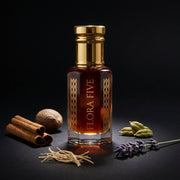 Dior Sauvage Elixir inspired attar for men — alcohol-free perfume oil by Flora Five: deep red-amber oil on black with cinnamon, nutmeg, cardamom and lavender
