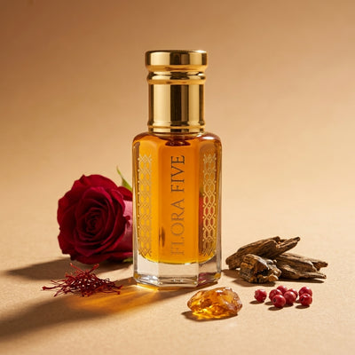 Dolce & Gabbana Velvet Desert Oud inspired unisex oud by Flora Five — alcohol-free oudh oil: gold-capped bottle of golden amber oil on beige with a red rose, saffron and oud chips – 3, 6 and 12 ml