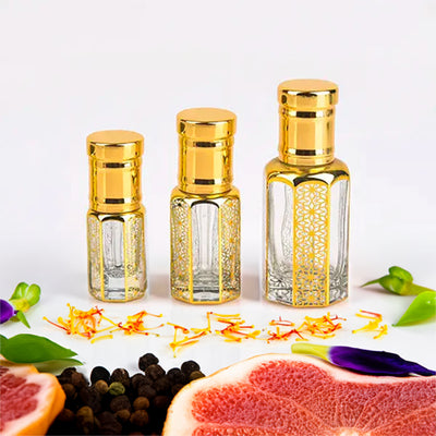 Versace Dylan Blue inspired attar for men by Flora Five — alcohol-free perfume oil: three empty gold-capped bottles of different heights with grapefruit, black pepper and saffron – 3, 6 and 12 ml