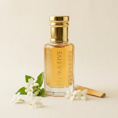 Mogra Khaalis Attar by Flora Five — gold-capped bottle of golden oil on cream with orange blossom, jasmine and a sandalwood stick – 3, 6 and 12 ml