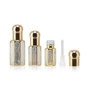 Rehmat Oud, unisex — alcohol-free oud oil (oudh) by Flora Five: three silver-and-gold patterned bottles in three sizes with dropper and spare cap