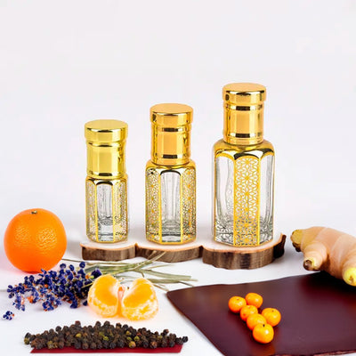Hugo Boss Bottled inspired attar for men by Flora Five — alcohol-free perfume oil: three empty gold-capped bottles of different heights with an orange, lavender and mandarin – 3, 6 and 12 ml