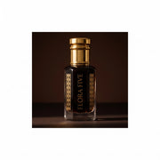 Dehn Al Oud Hindi for men — alcohol-free oud oil (oudh) by Flora Five: dark brown oil in a gold-capped bottle against a chocolate-brown backdrop