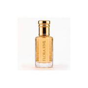 Louis Vuitton Imagination inspired attar for men — alcohol-free perfume oil by Flora Five: amber oil in a gold-capped bottle on a warm white backdrop
