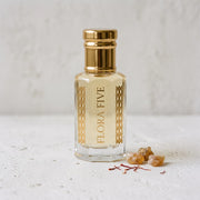 Mukhallat Abiyad Attar, unisex — alcohol-free perfume oil by Flora Five: pale ivory-gold oil on white plaster with frankincense tears and saffron threads