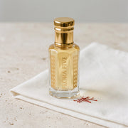 Oud Ehram unisex — alcohol-free oud oil (oudh) by Flora Five: pale golden oil on folded white cotton with saffron threads