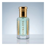 Rasasi Hawas inspired attar for men — alcohol-free attar oil by Flora Five: pale aqua oil in a gold-capped bottle on a soft blue-grey backdrop