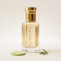 Acqua di Gio Absolu inspired attar for men by Flora Five — alcohol-free perfume oil: gold-capped bottle of pale straw oil with a lime slice and rosemary on white – 3, 6 and 12 ml