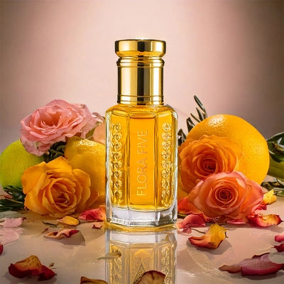 Amber Rose Attar by Flora Five – alcohol-free oil perfume blending citrus, melon, rose, amber, and musk; joyful, elegant, and long-lasting in a radiant golden bottle