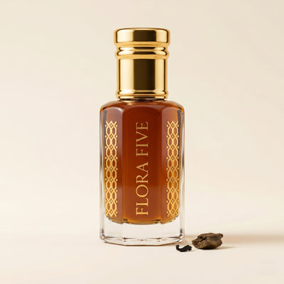 Amir Al Oud by Flora Five — gold-capped bottle of deep amber oil with an oud chip on cream – 3, 6 and 12 ml