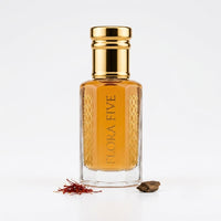 Aseel Attar by Flora Five — gold-capped bottle of golden amber oil with saffron and an oud chip on white – 3, 6 and 12 ml