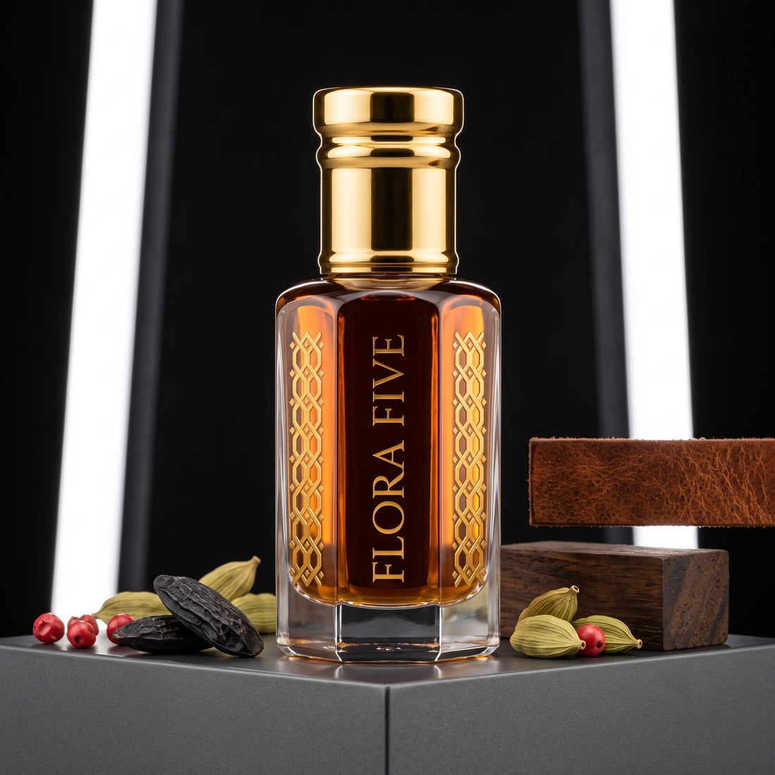 Bentley For Men Intense Inspired Attar by Flora Five — gold-capped bottle of deep amber oil on a dark plinth with tonka beans, cardamom and peppercorns – 3, 6 and 12 ml