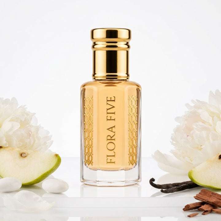 Burberry Brit for Women Inspired Attar by Flora Five — gold-capped bottle of golden yellow oil with pear, white flowers and a vanilla pod on white – 3, 6 and 12 ml