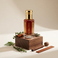 Burberry London inspired attar for men by Flora Five — alcohol-free perfume oil: gold-capped bottle of deep red-amber oil on a walnut block with thyme and cinnamon sticks – 3, 6 and 12 ml