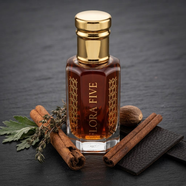 Burberry London for Men Inspired Attar by Flora Five — gold-capped bottle of deep red-amber oil on slate with cinnamon sticks, nutmeg and thyme – 3, 6 and 12 ml