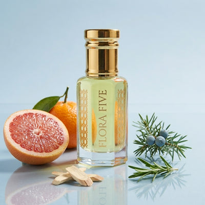 Dolce & Gabbana Light Blue inspired attar for men by Flora Five — alcohol-free perfume oil: gold-capped bottle of pale green-gold oil on blue with grapefruit, mandarin and juniper – 3, 6 and 12 ml