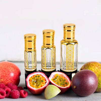 Fawakeh Attar by Flora Five — three empty gold-capped bottles of different heights with mango, passion fruit and raspberries – 3, 6 and 12 ml