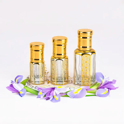 Givenchy Irresistible inspired attar for women by Flora Five — alcohol-free perfume oil: three empty gold-capped bottles of different heights on a ring of purple iris – 3, 6 and 12 ml