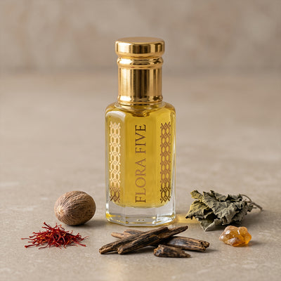 Lattafa Badee Al Oud inspired unisex oud by Flora Five — alcohol-free oudh oil: gold-capped bottle of golden yellow oil on stone with saffron, nutmeg and oud chips – 3, 6 and 12 ml