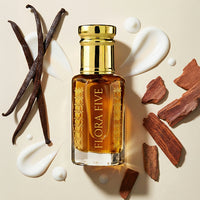 Flora Five perfume bottle with vanilla beans and cinnamon sticks on a beige background