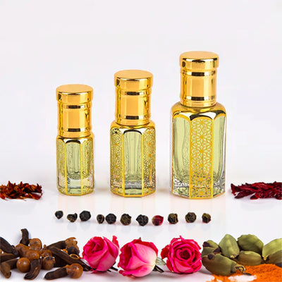 Oud Mazhar by Flora Five — three empty gold-capped bottles of different heights with cloves, black pepper and pink roses – 3, 6 and 12 ml