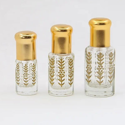 Versace Eros inspired attar for men by Flora Five — alcohol-free perfume oil: three empty gold-capped bottles of different heights with a gold leaf print – 3, 6 and 12 ml