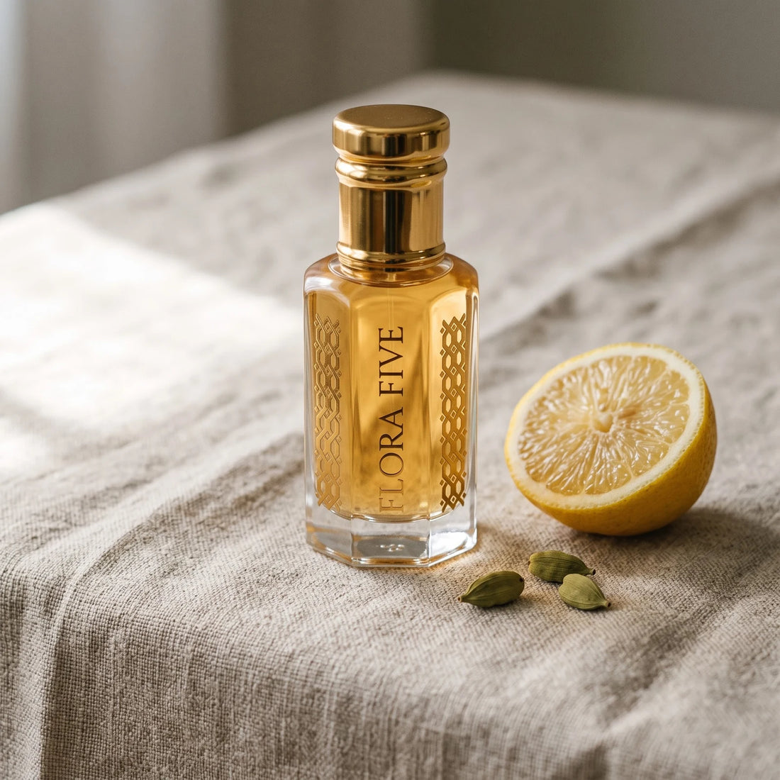 Ajmal Mukhallat Al Wafa inspired attar by Flora Five: amber oil roll-on bottle on linen with lemon and cardamom