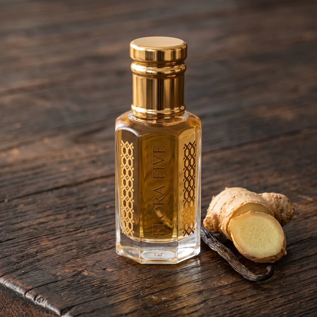 Azzaro The Most Wanted inspired attar by Flora Five: golden amber oil bottle on dark wood with ginger and vanilla