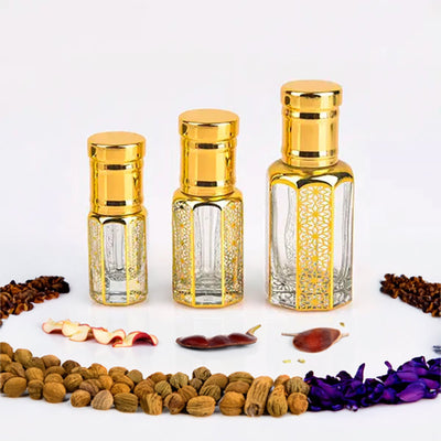 CR7 Black inspired attar for men by Flora Five — alcohol-free perfume oil: three empty gold-capped bottles of different heights with dried fruit, chillies and nuts – 3, 6 and 12 ml