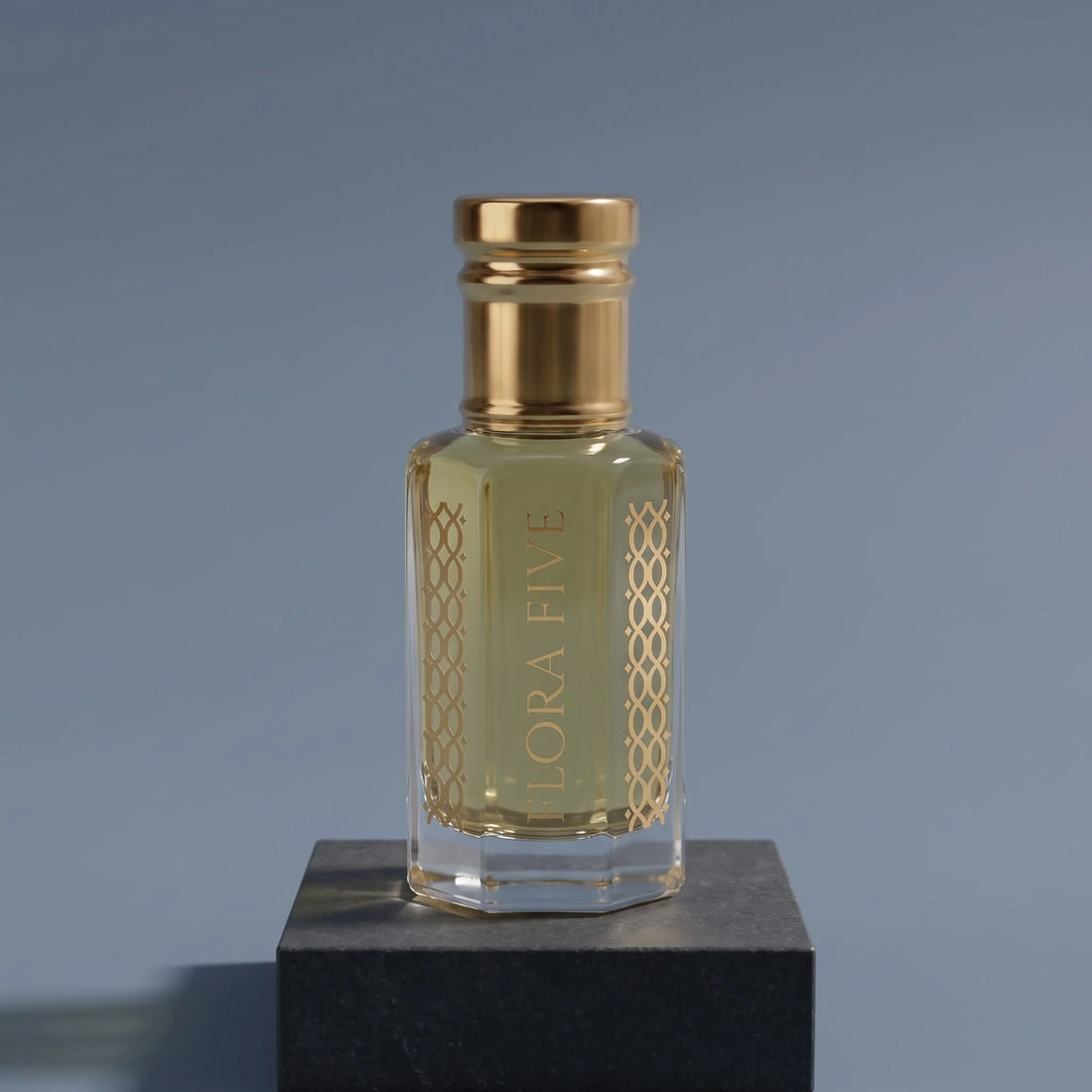 Dior Sauvage inspired attar for men — alcohol-free perfume oil by Flora Five: pale golden oil on a graphite block against a slate-blue backdrop