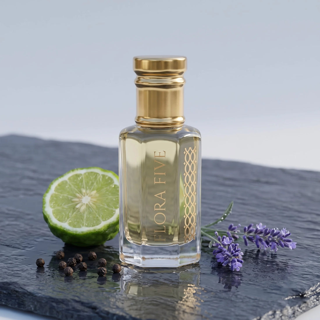 Dior Sauvage Inspired Attar by Flora Five — bottle on wet slate with half a bergamot, black peppercorns and lavender