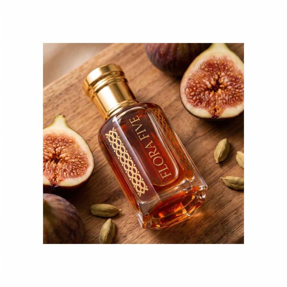 Diptyque Tam Dao inspired attar by Flora Five — bottle lying on a sandalwood board with halved figs and green cardamom pods
