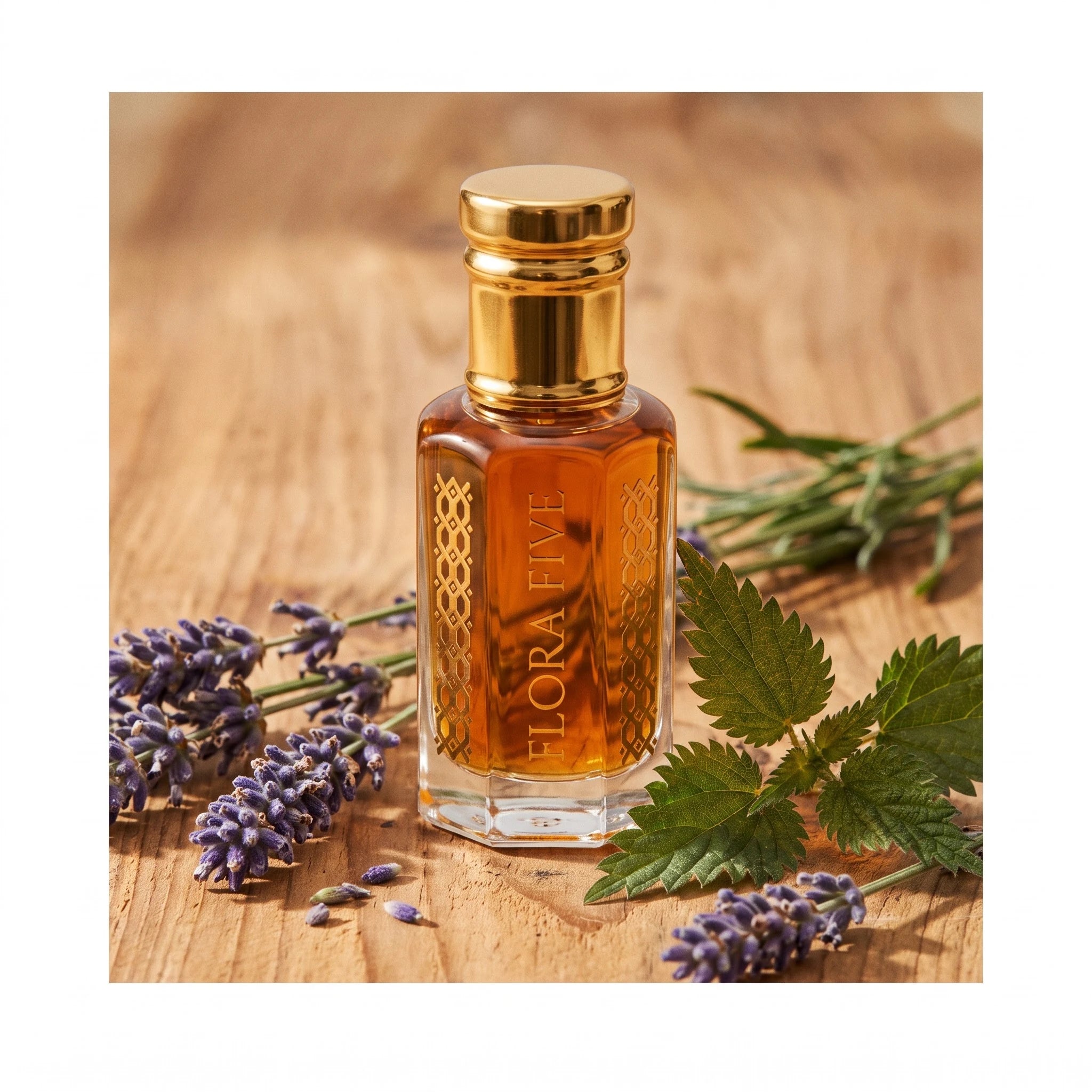Dunhill Black inspired attar by Flora Five — amber oil bottle on wood with lavender sprigs and nettle leaves