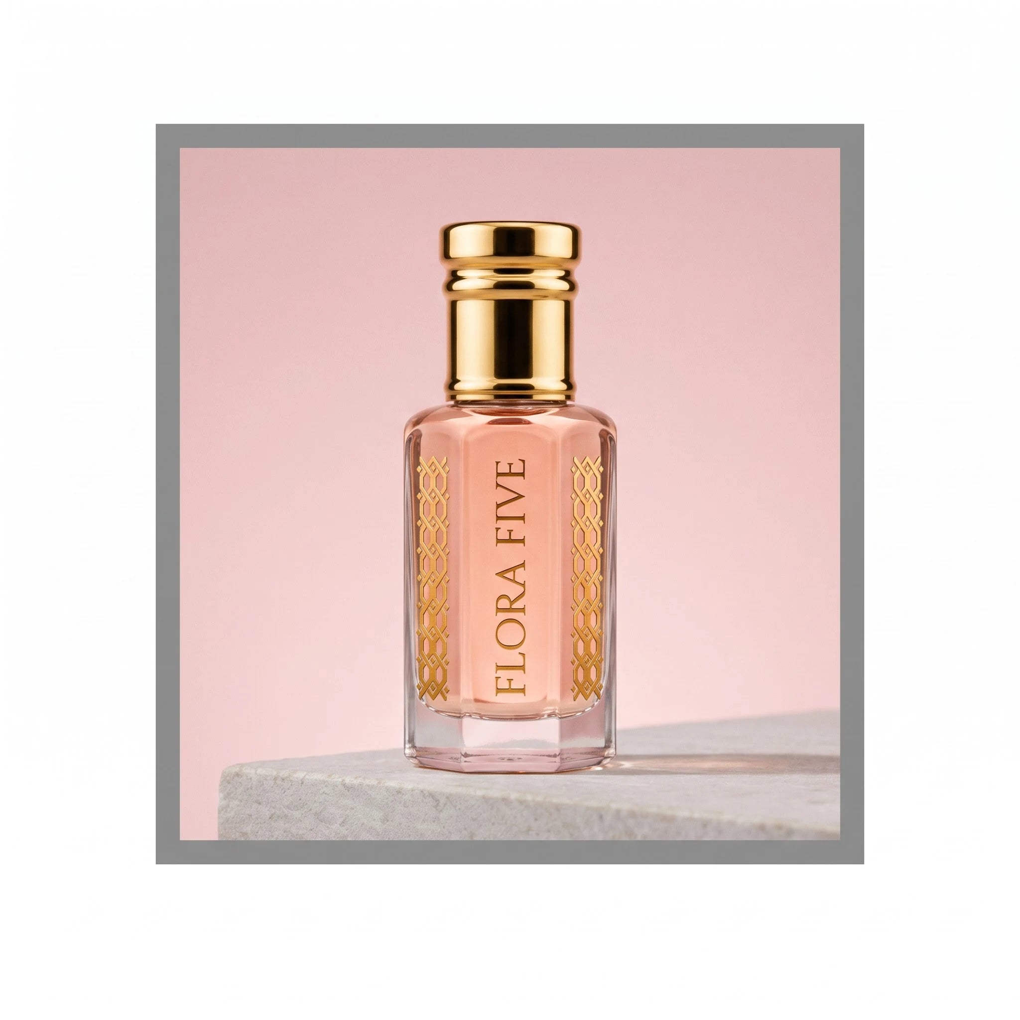 Gucci Paris inspired attar for women — alcohol-free perfume oil by Flora Five: pale pink oil on a stone ledge against a powder-pink backdrop