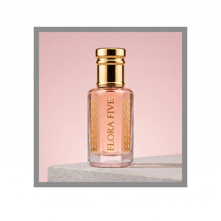 Gucci Paris inspired attar for women — alcohol-free perfume oil by Flora Five: pale pink oil on a stone ledge against a powder-pink backdrop