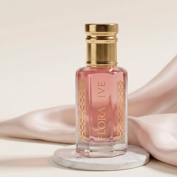 Gucci Paris inspired attar for women — alcohol-free perfume oil by Flora Five: pale pink oil on a white marble disc with blush silk on an ivory backdrop