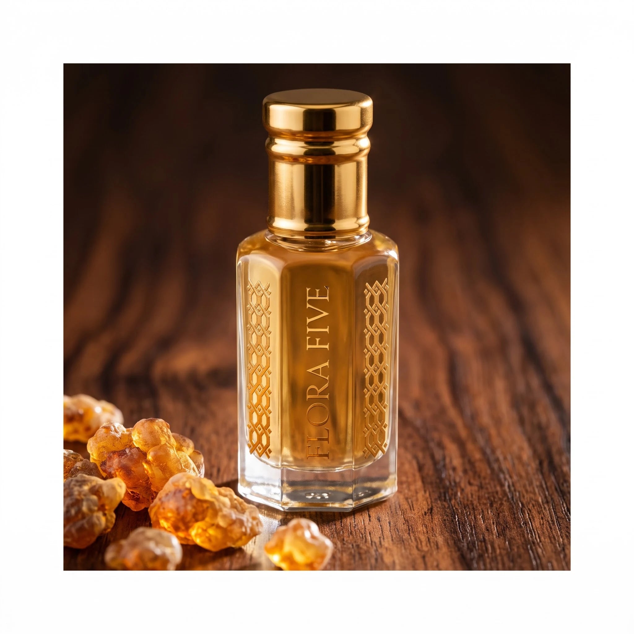 Jo Malone Myrrh & Tonka inspired attar by Flora Five — amber oil on dark wood behind glowing myrrh resin tears