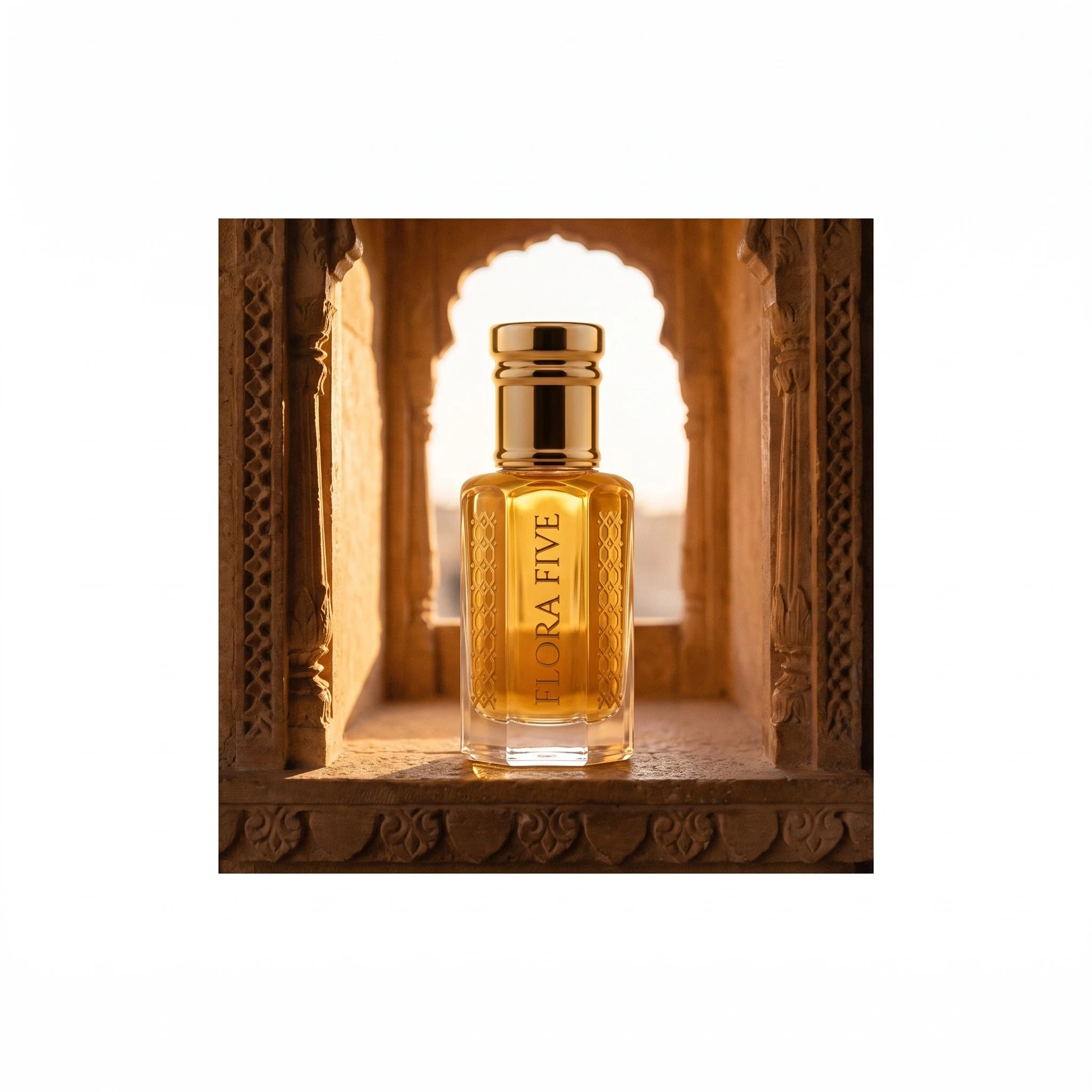 Kasturi Attar by Flora Five, alcohol-free attar oil: bottle on a sandstone haveli window at sunset – 3, 6 and 12 ml