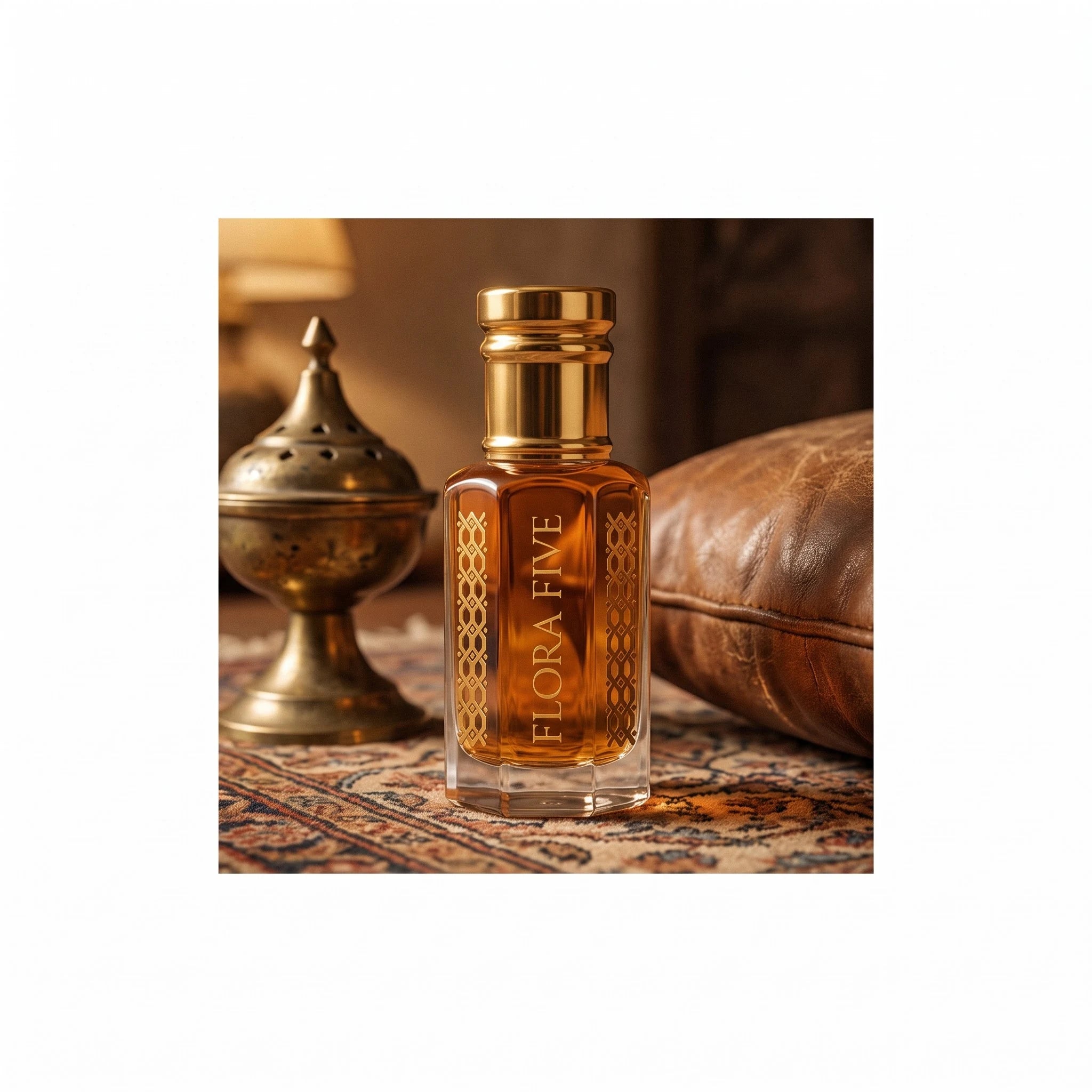 Khulasatal Oud by Flora Five — amber oud oil on a Persian rug beside a brass incense burner and a leather cushion