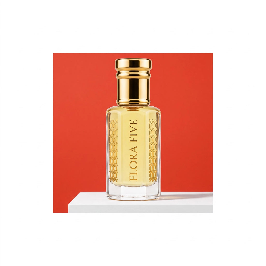 Lacoste Red inspired attar for men — alcohol-free perfume oil by Flora Five: pale gold oil in a gold-capped bottle on white against a red backdrop