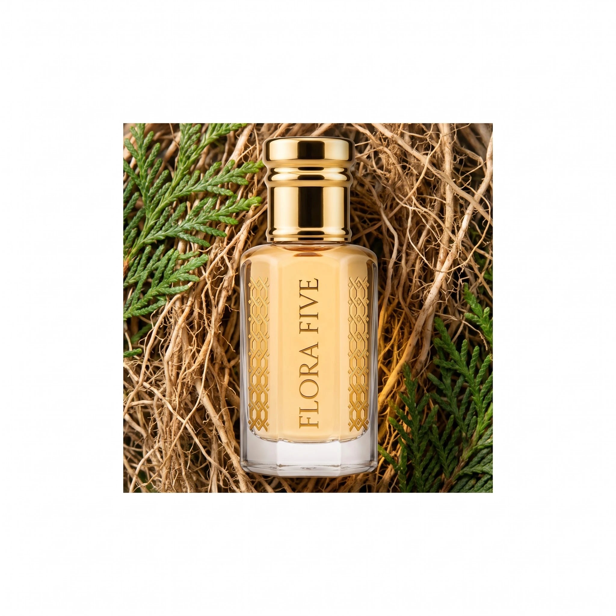 Lacoste Red inspired attar by Flora Five — bottle nestled in vetiver roots and green thuja sprigs