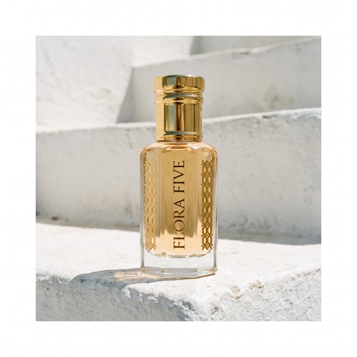 Louis Vuitton Imagination inspired attar by Flora Five, alcohol-free perfume oil: bottle on whitewashed steps at midday – 3, 6 and 12 ml