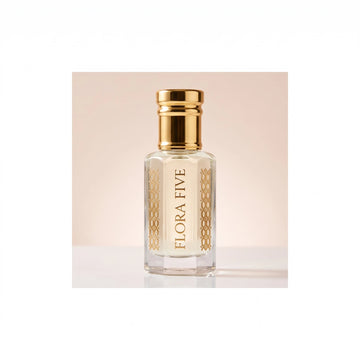 Mancera Coco Vanilla inspired attar for women — alcohol-free perfume oil by Flora Five: pale ivory oil in a gold-capped bottle on a blush-cream backdrop
