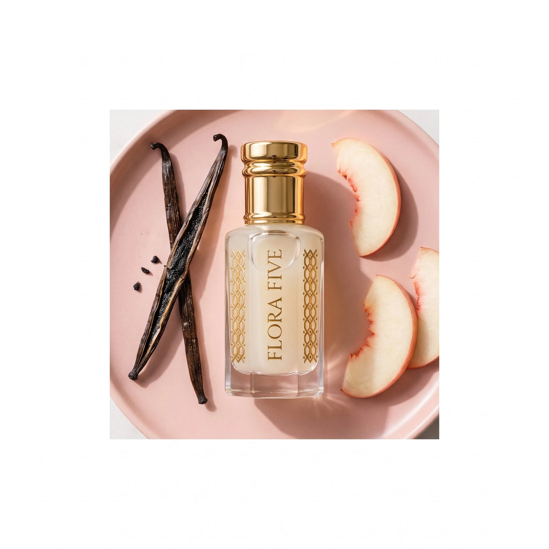 Mancera Coco Vanilla inspired attar by Flora Five — pale cream oil on a pink plate with vanilla pods and white peach slices