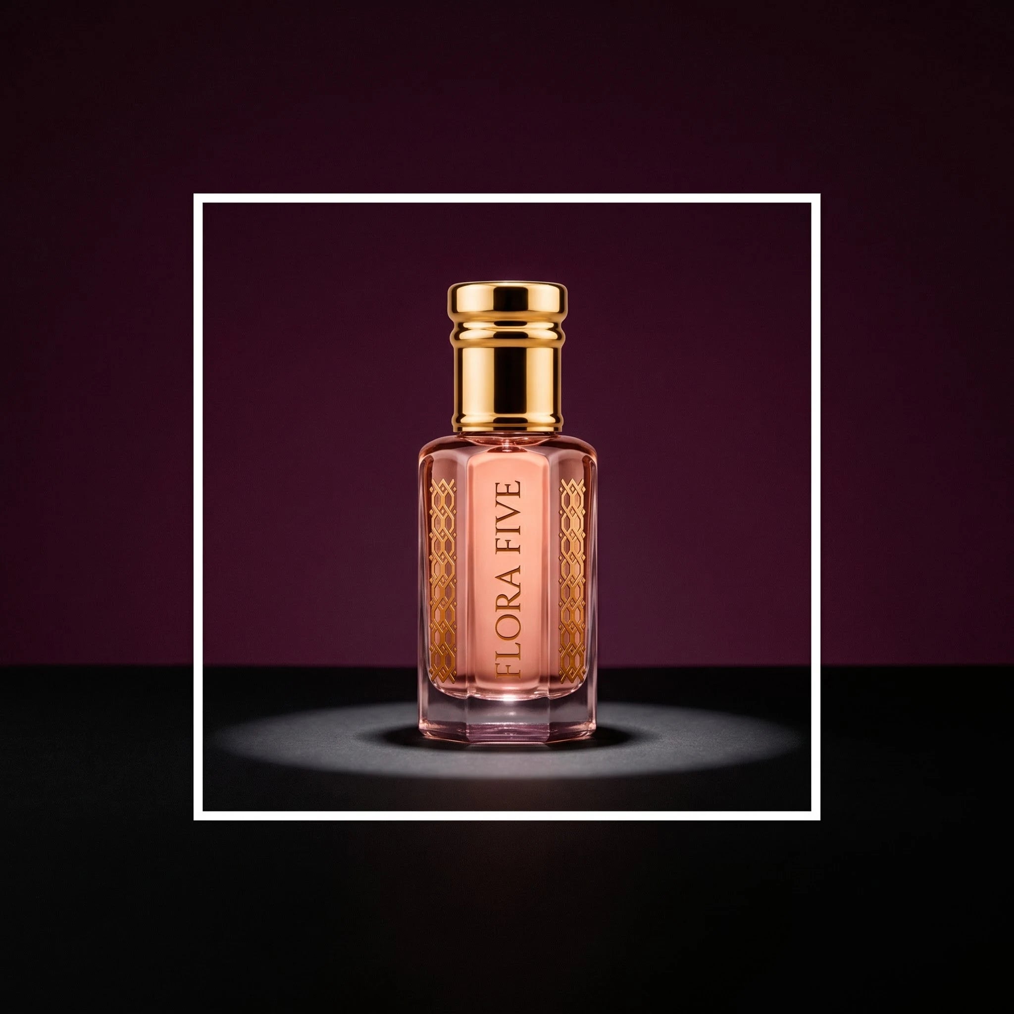 Wesal Attar by Flora Five, alcohol-free attar oil: bottle on a plum studio backdrop under a spotlight – 3, 6 and 12 ml