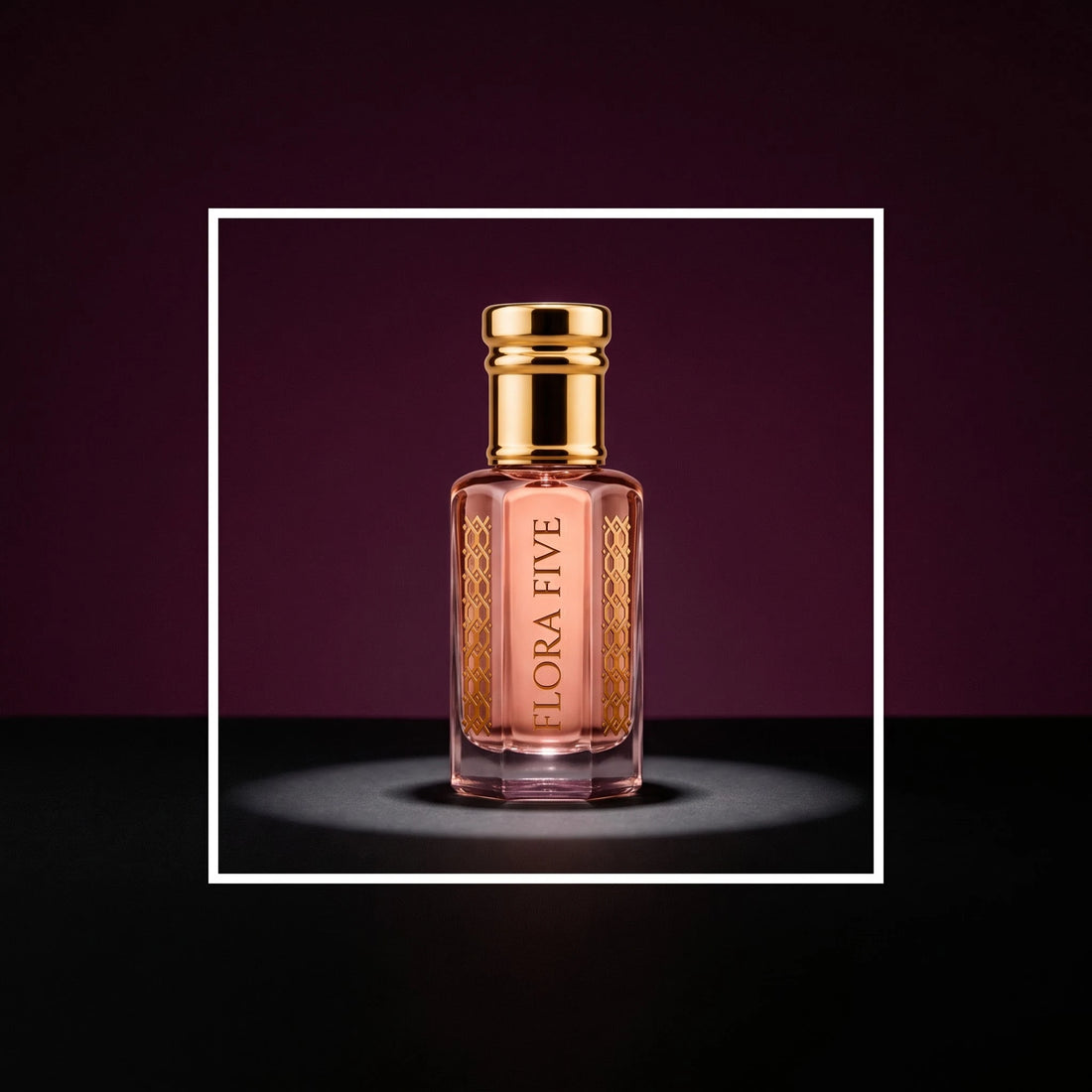 Wesal Attar by Flora Five, alcohol-free attar oil: bottle on a plum studio backdrop under a spotlight – 3, 6 and 12 ml