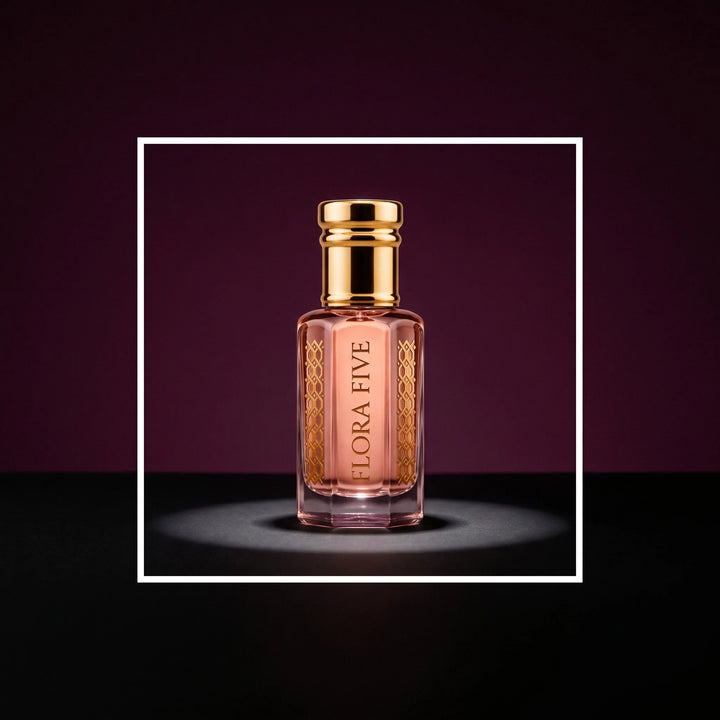 Wesal Attar by Flora Five, alcohol-free attar oil: bottle on a plum studio backdrop under a spotlight – 3, 6 and 12 ml