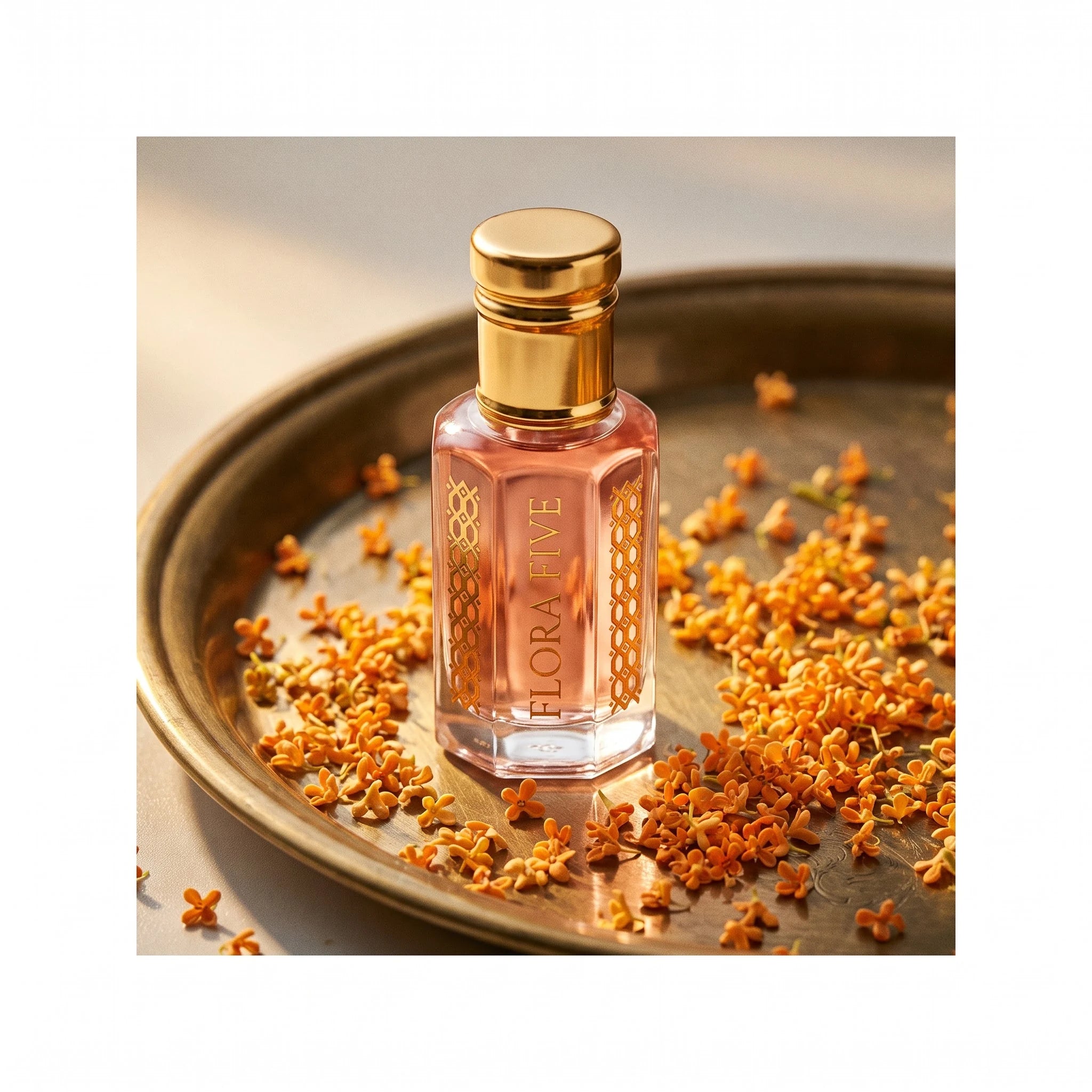 Wesal Attar by Flora Five, alcohol-free attar oil: bottle on a brass tray with osmanthus blossoms – 3, 6 and 12 ml
