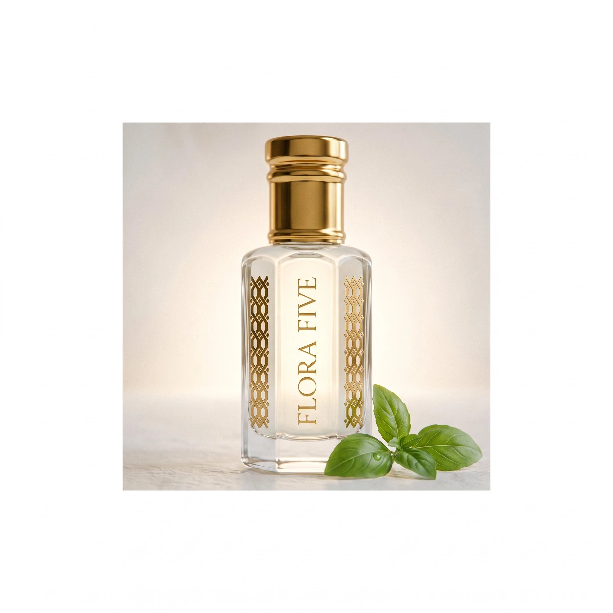 White Firdaus Attar by Flora Five — backlit close-up of the pale oil with fresh basil leaves